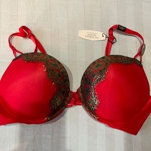 Red bombshell bra with lace trim. size 36B. adds 2 cup sizes. Brand new.